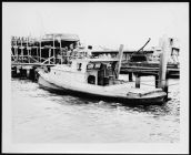 Misc. Photo.  Small vessel tied to dock